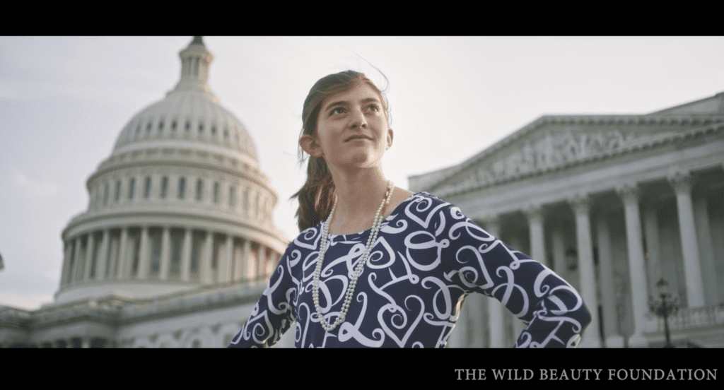 A Still of Josselyn Wolf Standing Powerfully at our Nation's Capitol from a WBF PSA 